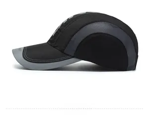 Detail of breathable grey mesh and reflective brim on black quick-dry sport baseball cap