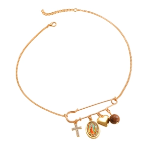 Detail of vintage gold necklace with cross, Mary medal, heart, and wood bead charms