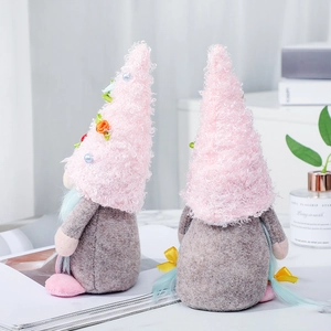 Pink and grey Mother's Day gnome doll with long braids and flower hat for tabletop decor