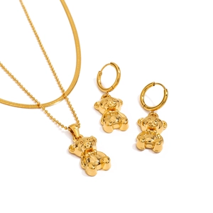 Golden bear pendant necklace and stud earrings set in polished stainless steel jewelry