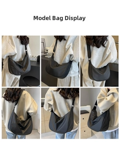 Detail showing the adjustable black strap and silver buckle of the nylon crescent bag
