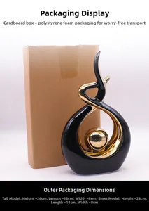 Abstract modern ceramic sculpture in black and gold with dimensions on packaging box