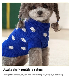 Close-up of blue knit pet sweater with white cloud patterns and ribbed knit collar detail