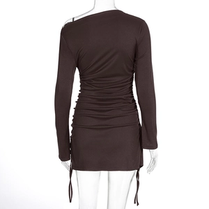 Detail view of the back side of dark brown ribbed knit dress with ruched drawstring design
