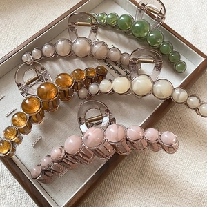 Elegant large resin hair claws with marble bead texture in five retro vintage colors