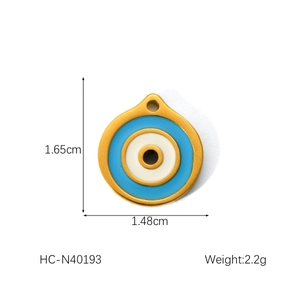 Detail view of round evil eye pendant with dimensions 1.65cm height and 1.48cm width