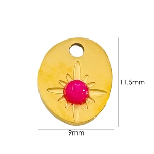 Macro shot of gold starburst pendant with pink stone inlay and 11.5x9mm dimensions