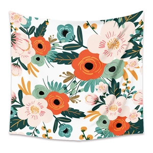 Close-up detail of Bohemian floral wall tapestry with vibrant orange and pink blossoms