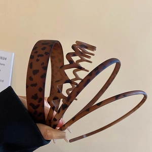 Detail of vintage leopard print headbands in four styles with matte acetate finish