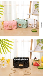 Macro detail of quilted jelly mini bag showing gold chain strap and twist lock closure
