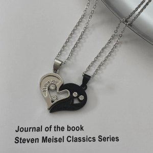 Detail of interlocking heart pendants with I LOVE YOU engraving and white rhinestones