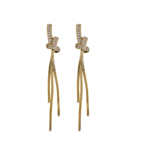 Elegant gold plated knot tassel earrings with sparkling zircon stones in a minimalist style