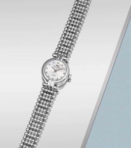 Detailed macro view of silver beaded chain watch with sparkling rhinestone hour markers