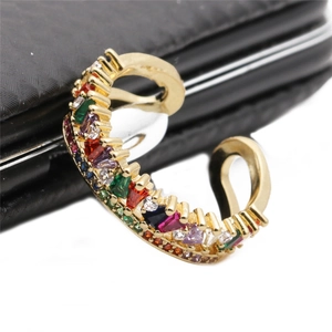 Adjustable gold ring featuring vibrant multi-color zircon stones and a textured edge