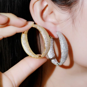 Chic gold and silver hoop earrings with pavé micro-set cubic zirconia for party wear