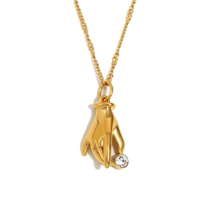 Minimalist 18K gold plated stainless steel necklace with hand holding white zircon pendant