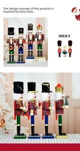 Detail of four wooden nutcracker soldiers in red and black plaid uniforms with bases