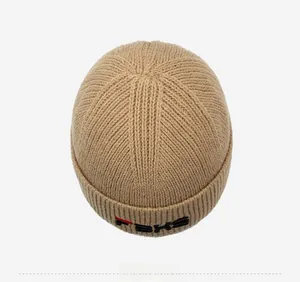 Top view of ribbed knit camel miki hat with black embroidery and red line details
