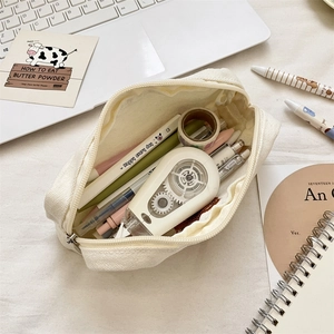Spacious beige canvas pencil case with cute bear embroidery and stationery storage detail