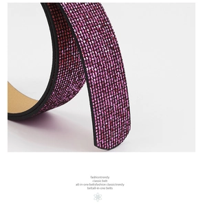 Close-up of pink rhinestone belt with black synthetic leather and rounded tip finish