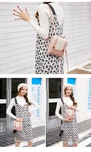Small pink and beige crossbody backpack shown on a model in a lifestyle setting