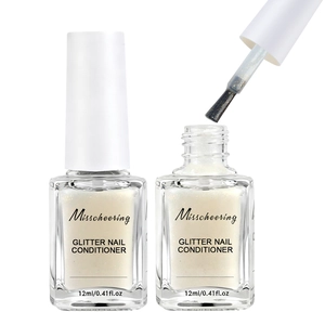 Detail of glitter nail conditioner brush and white pearlescent liquid in 12ml glass bottle