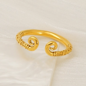 Vintage golden Sun Wukong open ring featuring intricate engraved scrollwork on the ends