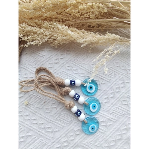 Three-piece evil eye hanging set with blue glass discs and natural jute twine detail