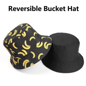 Reversible bucket hat with yellow banana print on black and solid black classic style