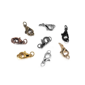 Macro detail of alloy lobster clasps in seven assorted metal finishes for DIY jewelry