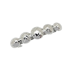 Minimalist silver metal hair clip with five linked spheres and hammered texture detail