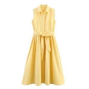 Sleeveless yellow shirt dress with waist belt and turn-down collar on white background