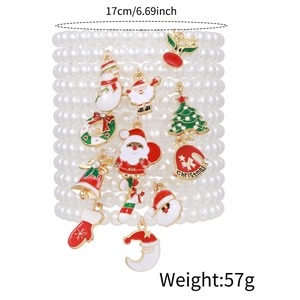 Christmas multilayer pearl bracelet set with Santa Claus and tree charms on white background