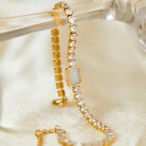 Elegant gold plated stainless steel bracelet with rectangular white stone and zircon accents