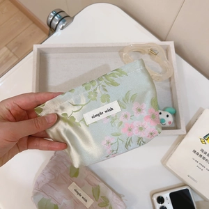 Floral mini canvas makeup pouch with green fabric, pink cherry patterns and simple wish label