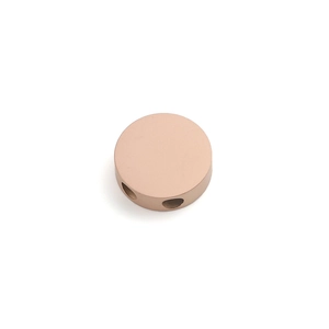Macro detail of a rose gold 20mm stainless steel round bead with dual side holes