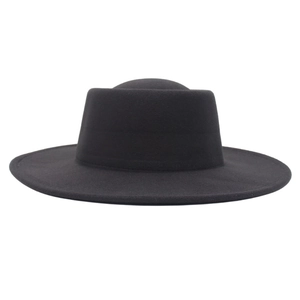 Side view detail of a classic black wool felt flat top hat with a wide stiff brim