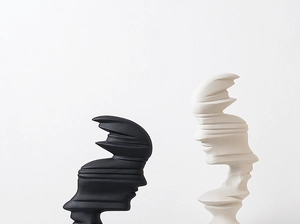 Close-up of modern abstract black and white silhouette sculptures with matte finish