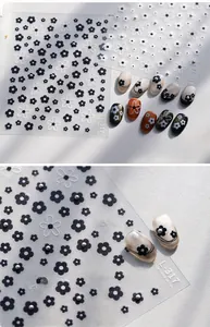 Detailed view of TL-317 black and white 3D floral nail art stickers with daisy patterns