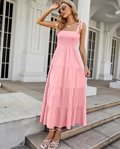 Detailed close-up of pink strapless tiered maxi dress with ruched bodice and delicate ruffles