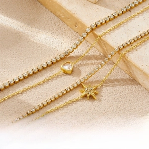 Close-up of gold-plated double-layer necklace set with star and heart zircon pendants