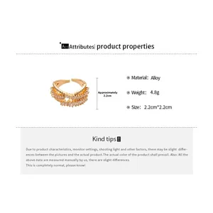 Detail showing dimensions and 4.8g weight of a gold-plated zircon crisscross ring