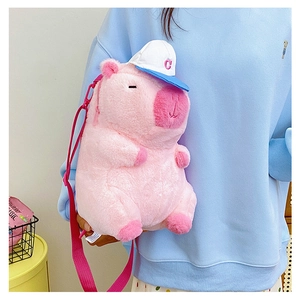 Detailed view of pink plush Capybara crossbody bag with cute baseball cap and strap