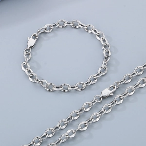 Detail of 6mm stainless steel lip chain with lobster clasp and unique twisted link design