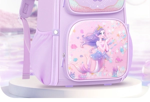 Detail of purple school bag featuring 3D mermaid relief and sparkling sea elements
