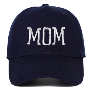 Detailed close-up of white MOM embroidery on a navy blue cotton baseball cap