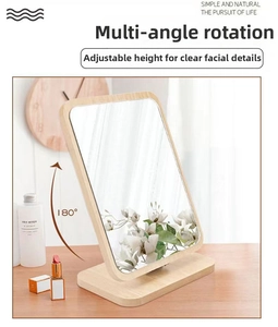 Detail of wooden makeup mirror showing 180-degree rotation feature and natural grain texture