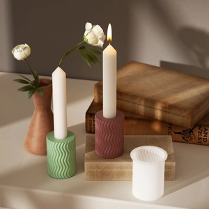 Macro view of geometric stripe resin molds with wavy candle holder base plaster samples