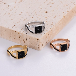 Retro square black diamond rings in gold silver and rose gold on stone display