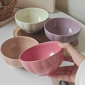 Set of 4 pumpkin-shaped ceramic bowls in pastel pink purple beige and yellow colors